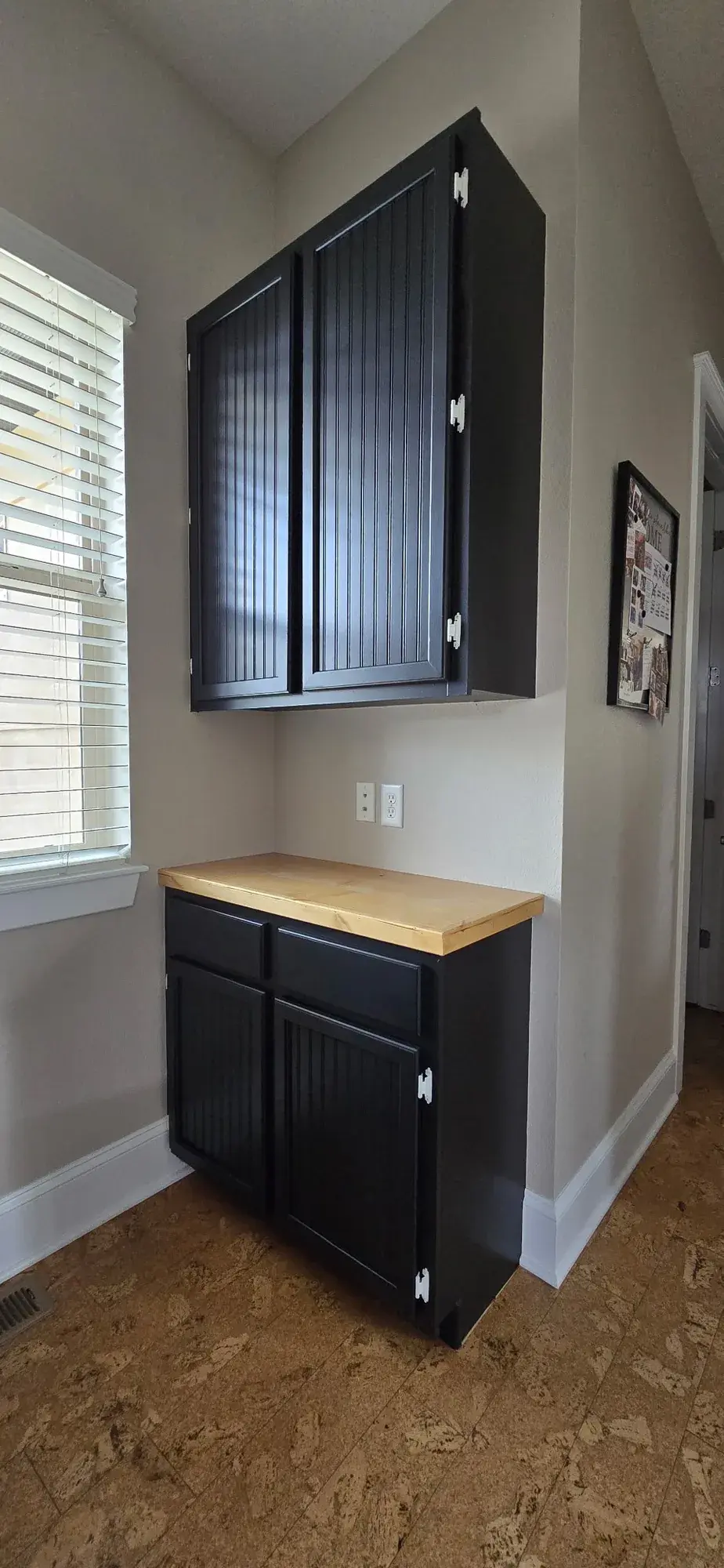Dark cabinetry with a smooth sprayed finish from Mach Paint Co.