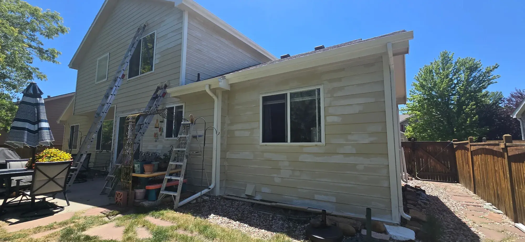 Light residential exterior during patching and surface preparation