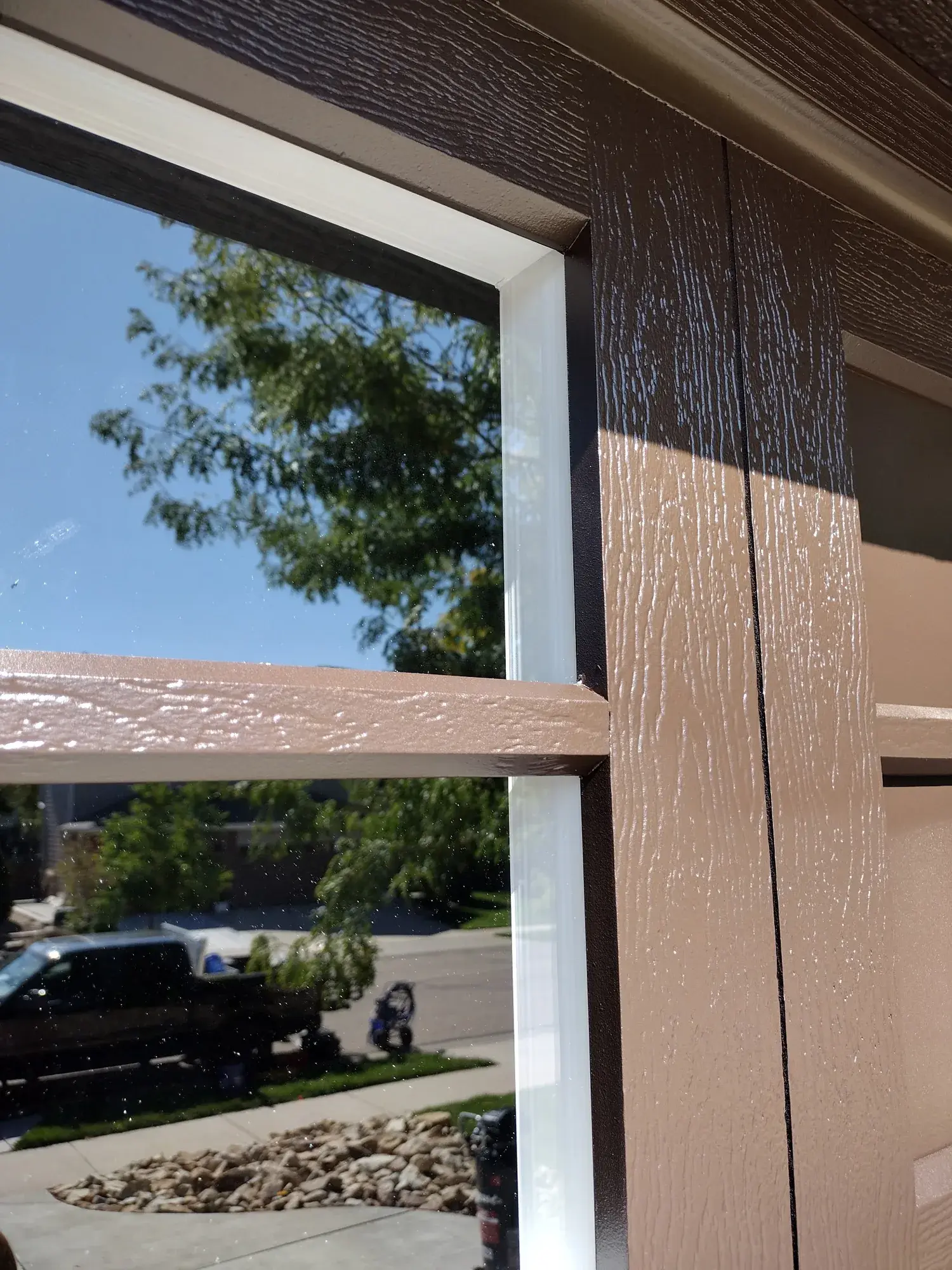 Exterior window trim and siding detail during painting work