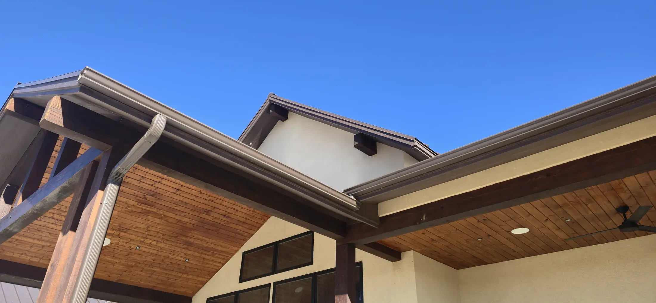 Close exterior detail showing finished soffit and wood architectural elements