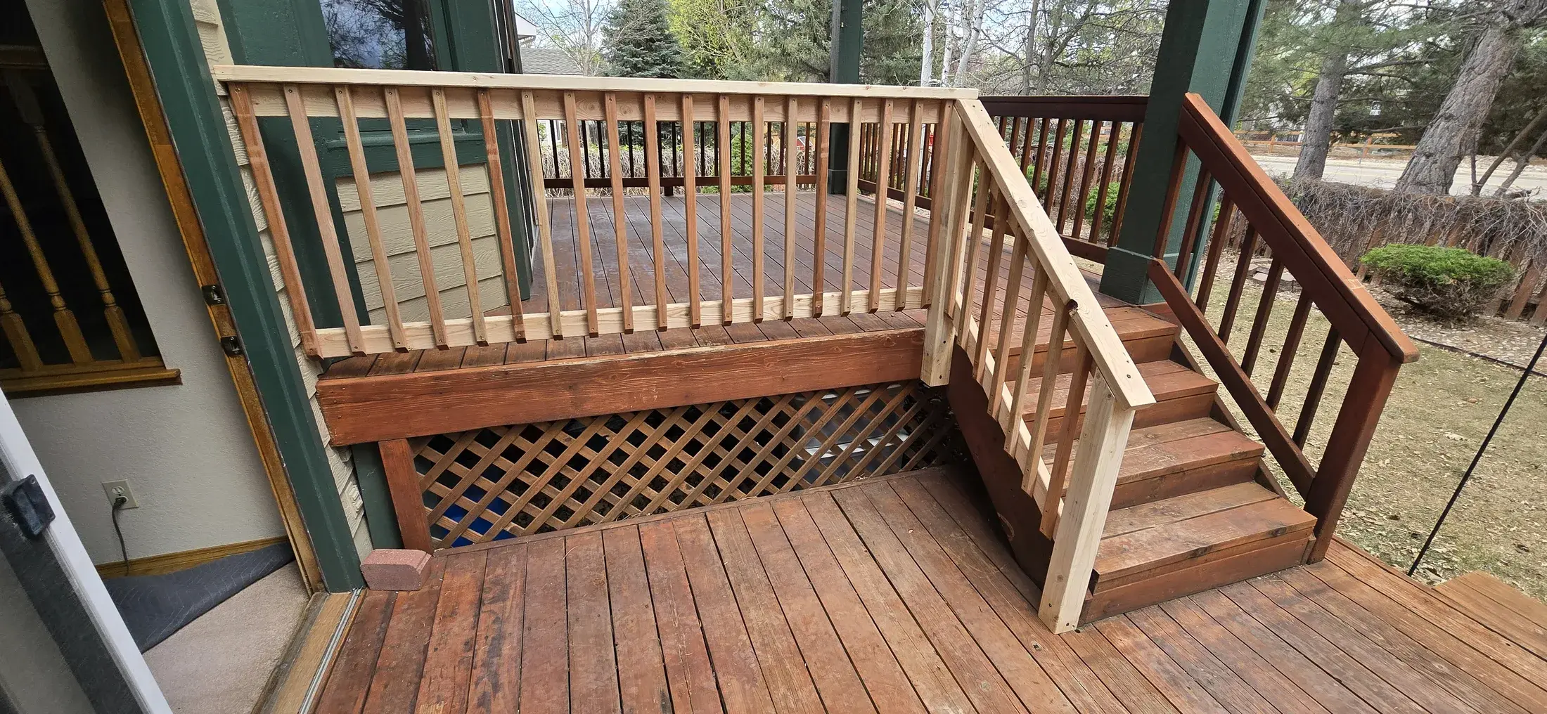 Deck stair and railing detail during repair and finish preparation