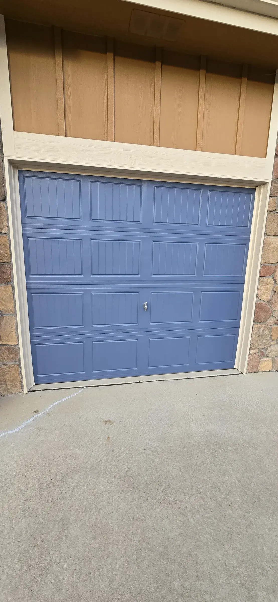 Alternate view of freshly finished garage doors and surrounding trim