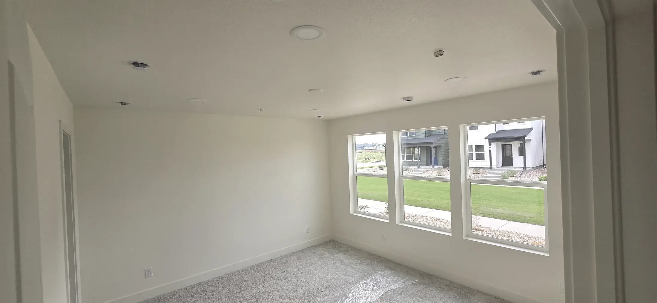 Bright finished interior with soft neutral walls and white trim